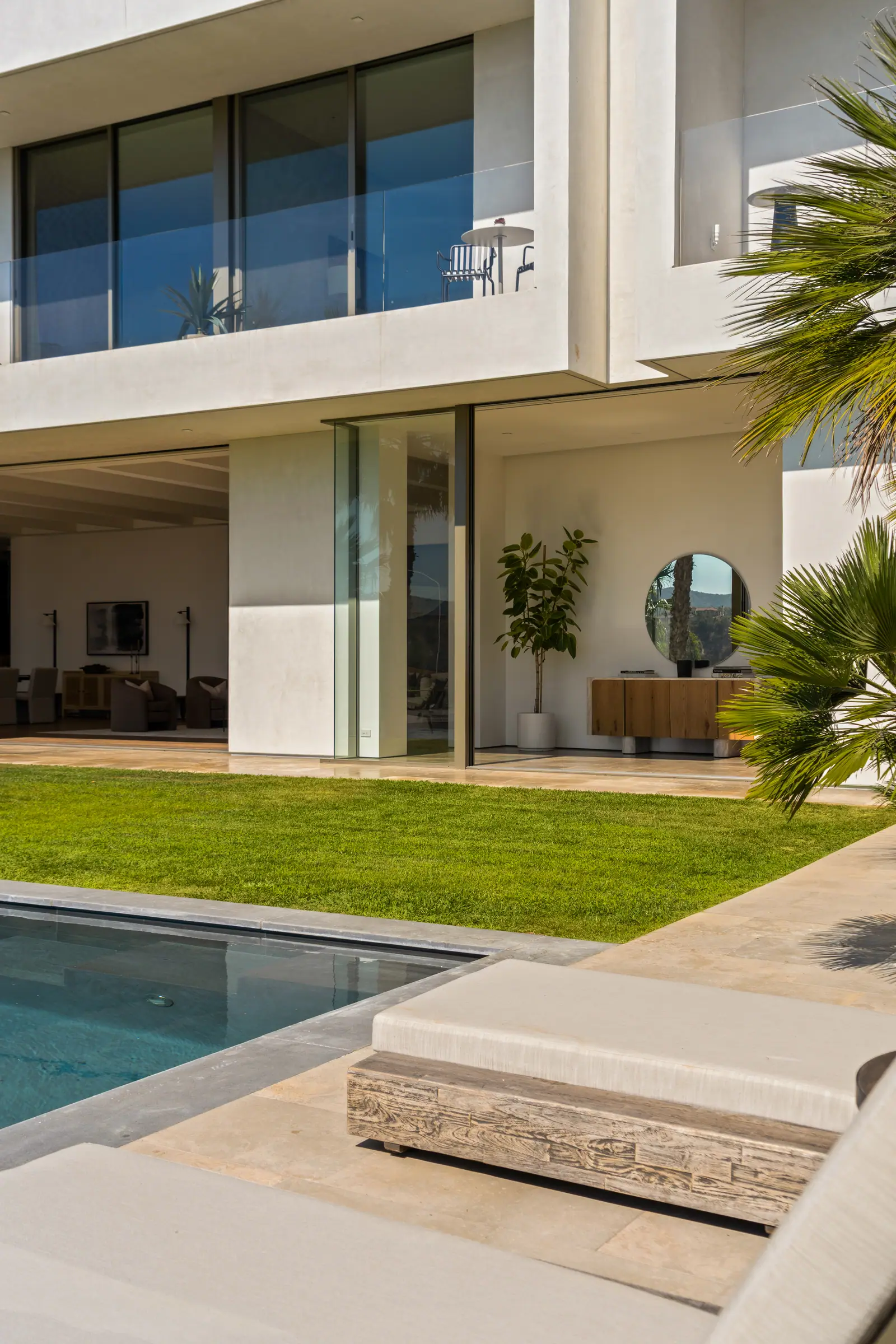 Lawn running to the house with the pool terrace alongside